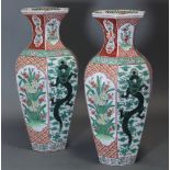 A PAIR OF 19th century JAPANESE KUTANI HEXAGONAL BALUSTER VASES, the bodies decorated with