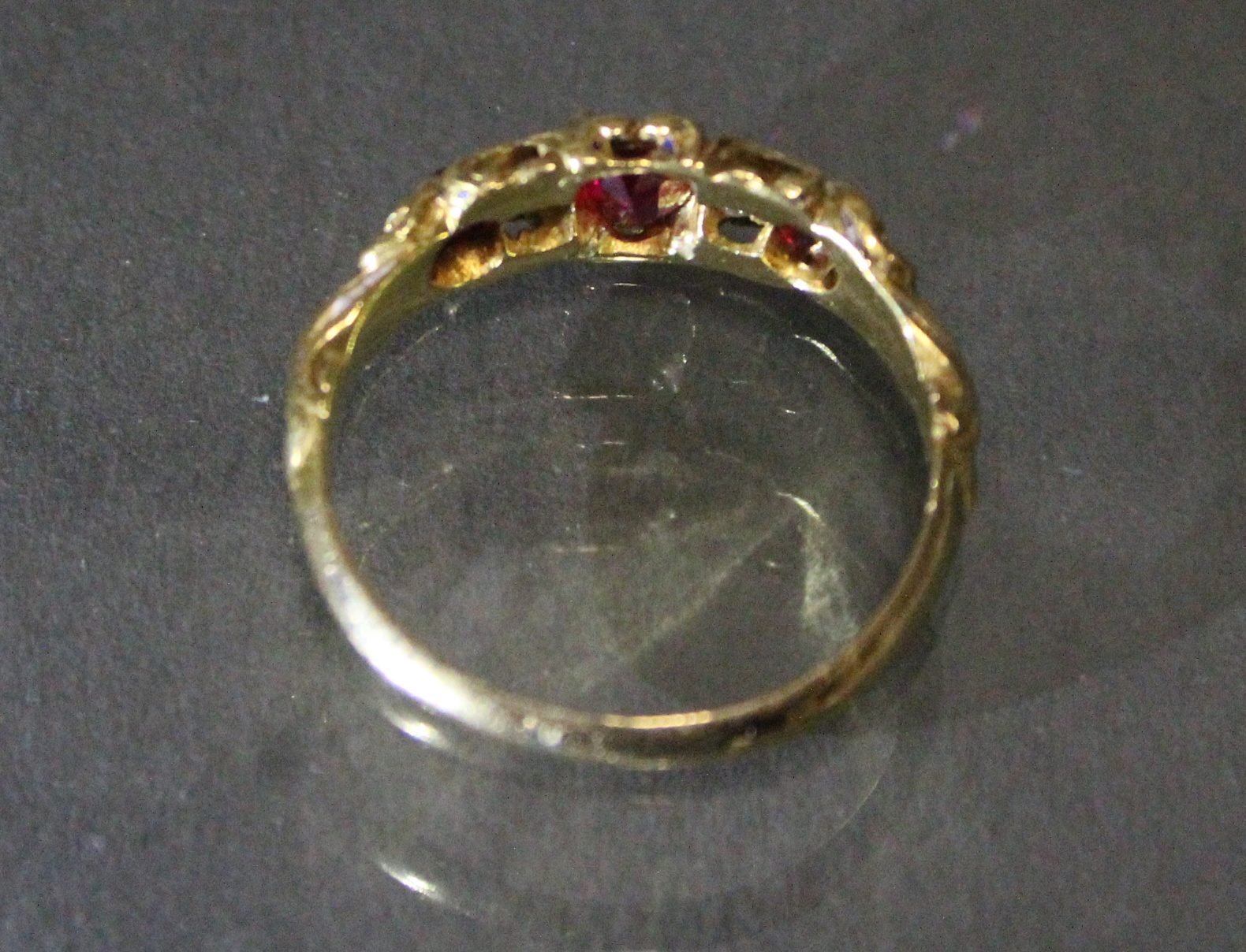 A Victorian un-marked gold ring set three oval rubies with cushion-shaped diamonds in between, - Image 3 of 3