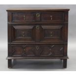 A 17th century OAK JACOBEAN SMALL CHEST, fitted three drawers with applied geometric mouldings &