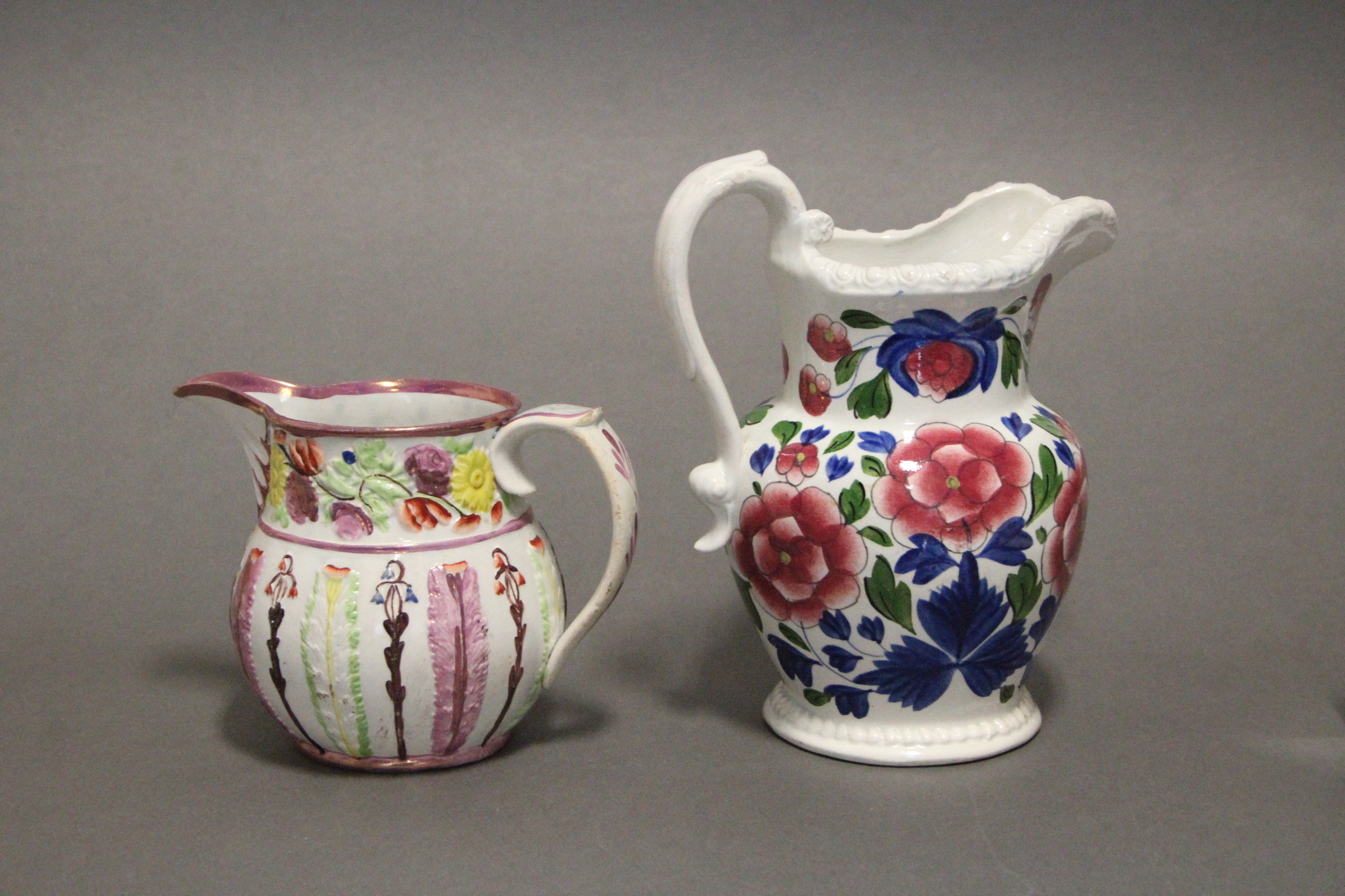 An early 19th century Swansea pottery bulbous jug with gadrooned rim, & with floral decoration in - Image 3 of 4