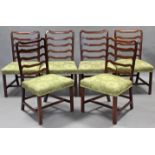 A SET OF SIX LATE 18th century MAHOGANY DINING CHAIRS, with shaped ladder backs, padded seats