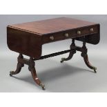 A Regency mahogany sofa table, fitted one real & one false drawer to each side, on