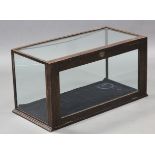 A 19th century table-top display case with glazed top & sides, enclosed by hinged lift-door, in