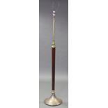 An early 20th century mahogany & brass standard lamp on tapering centre column & silvered circular