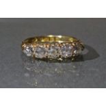 An Edwardian 18ct. gold ring set five graduated diamonds, Chester hallmarks for 1907; size: I/J;
