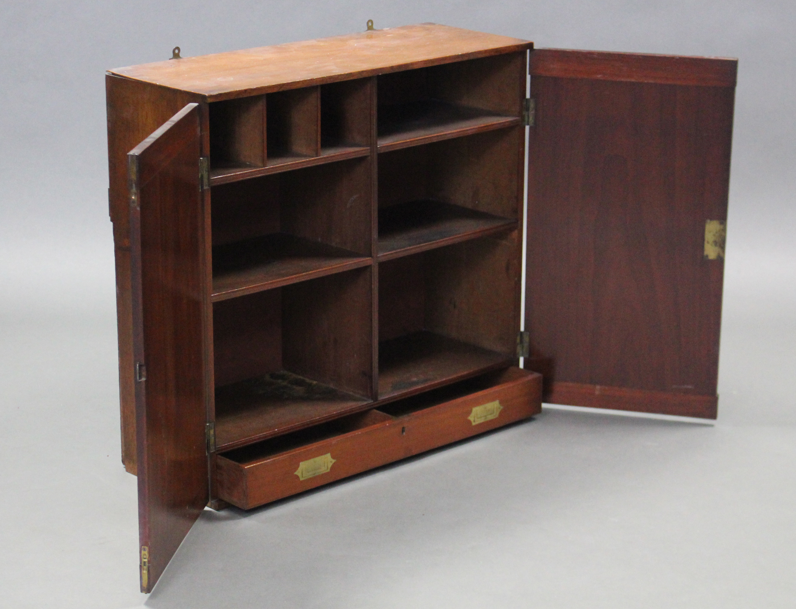 AN EARLY 19th century TEAK CAMPAIGN WALL-MOUNTED CABINET, fitted with an arrangement of five shelves - Image 2 of 2