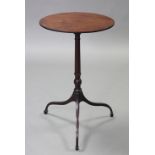 A George III mahogany wine table, with oval top on turned centre column & slender curved legs with