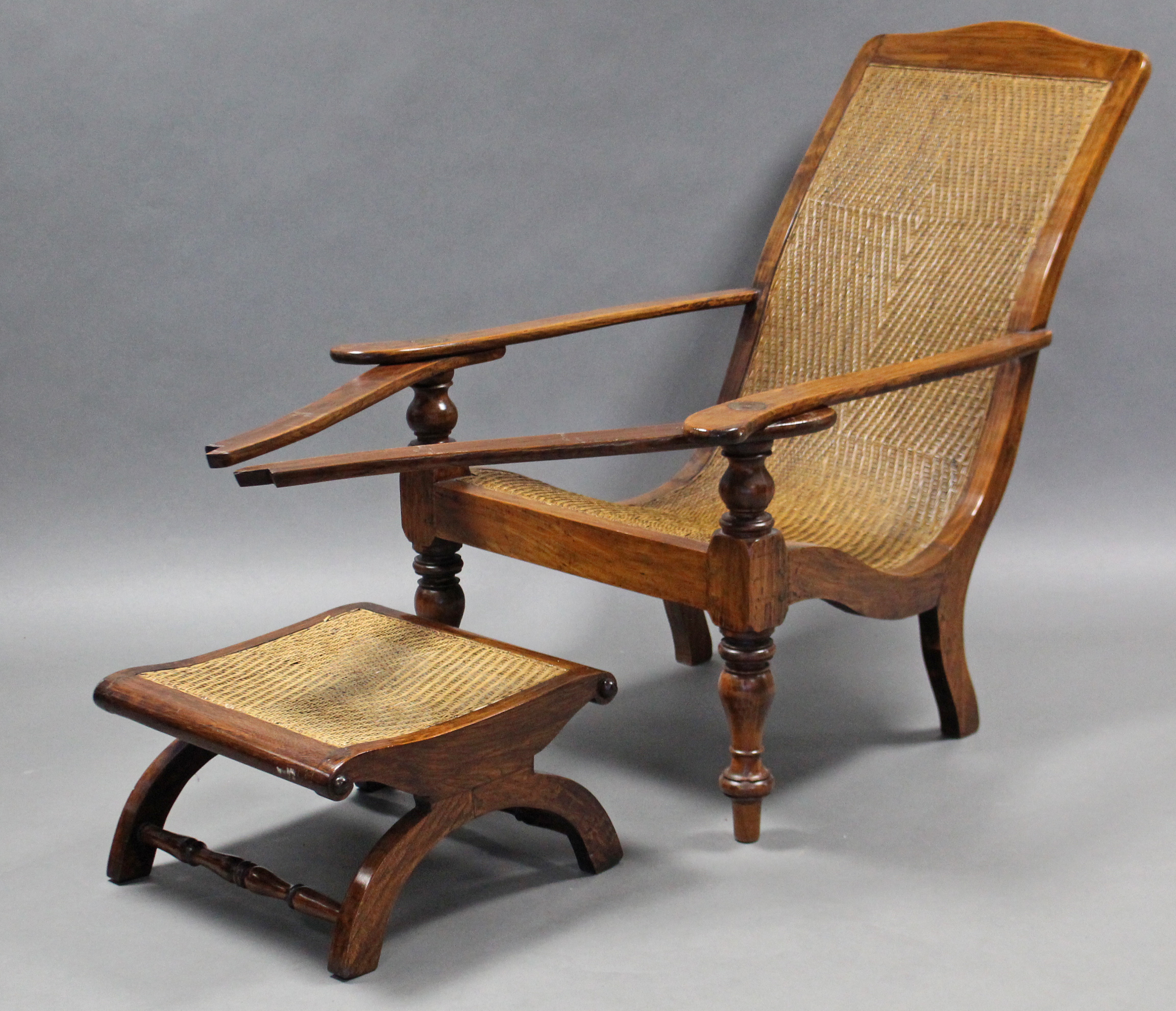 A 19th century rosewood plantation chair, with cane seat & back , curved open arms with fold-out - Image 2 of 2