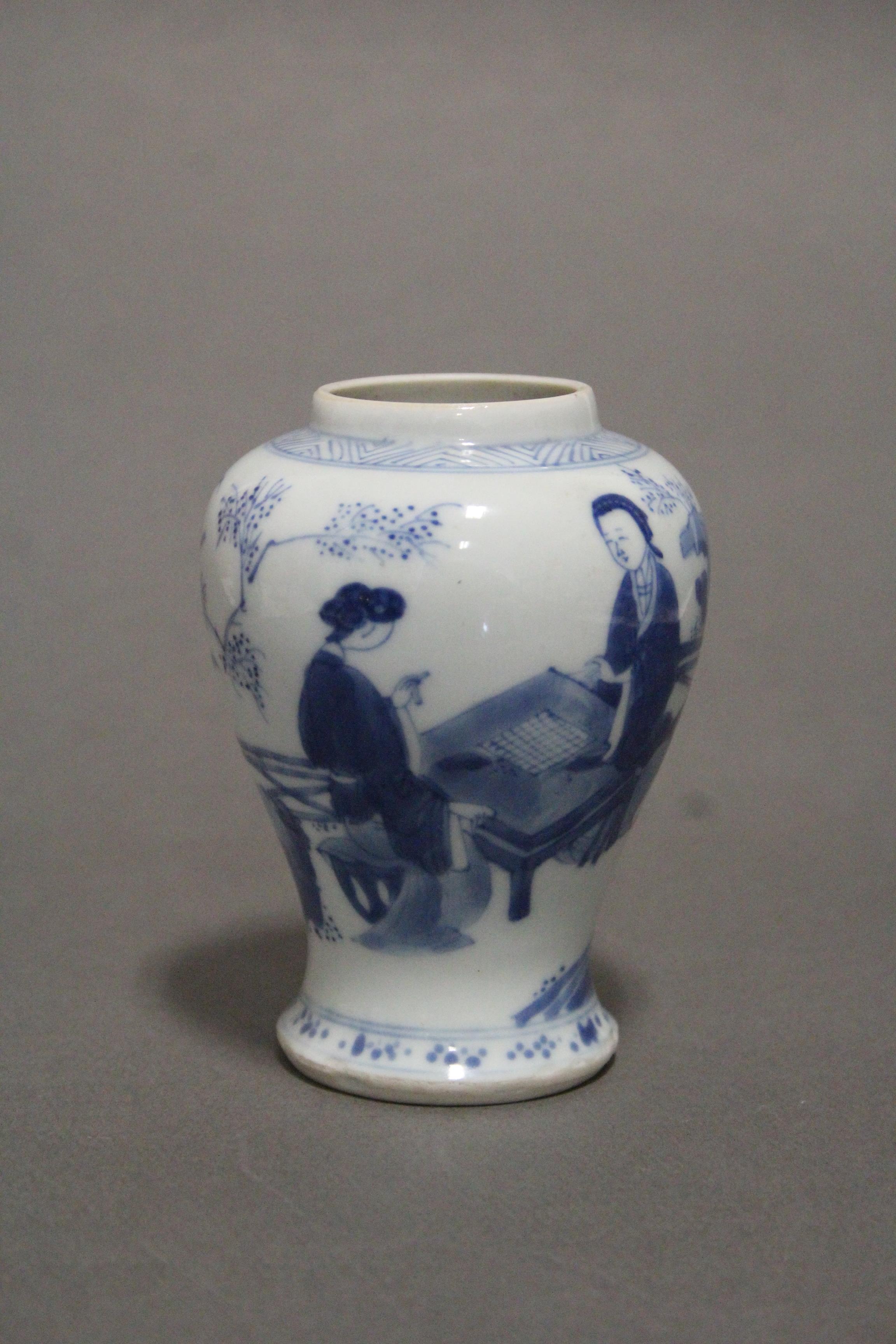 A Chinese Kangxi period blue & white porcelain small baluster vase painted with ladies in a formal - Image 8 of 11