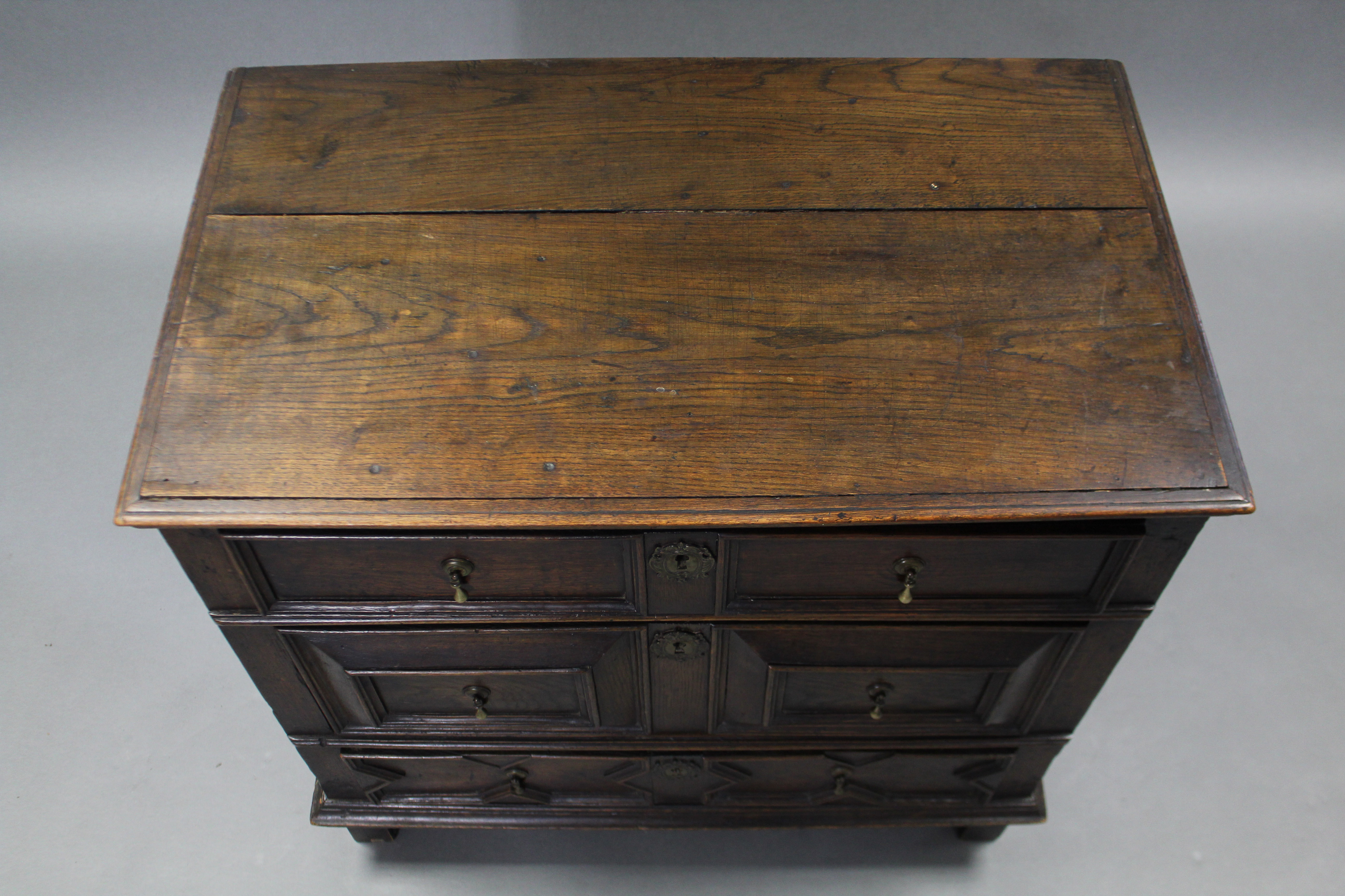 A 17th century OAK JACOBEAN SMALL CHEST, fitted three drawers with applied geometric mouldings & - Image 3 of 5