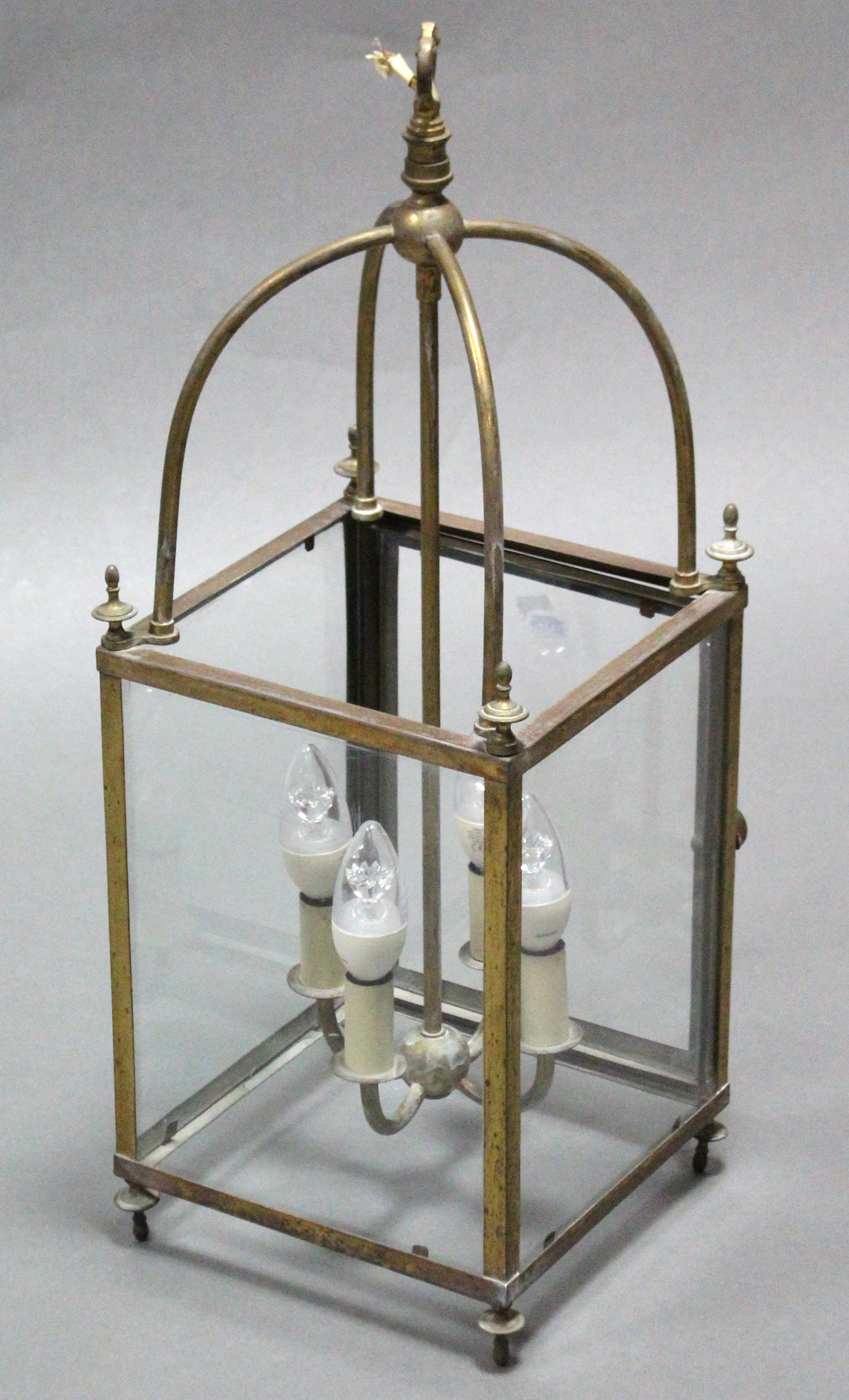 A brass framed hall lantern (converted to electricity), fitted a four-branch light fixture to the