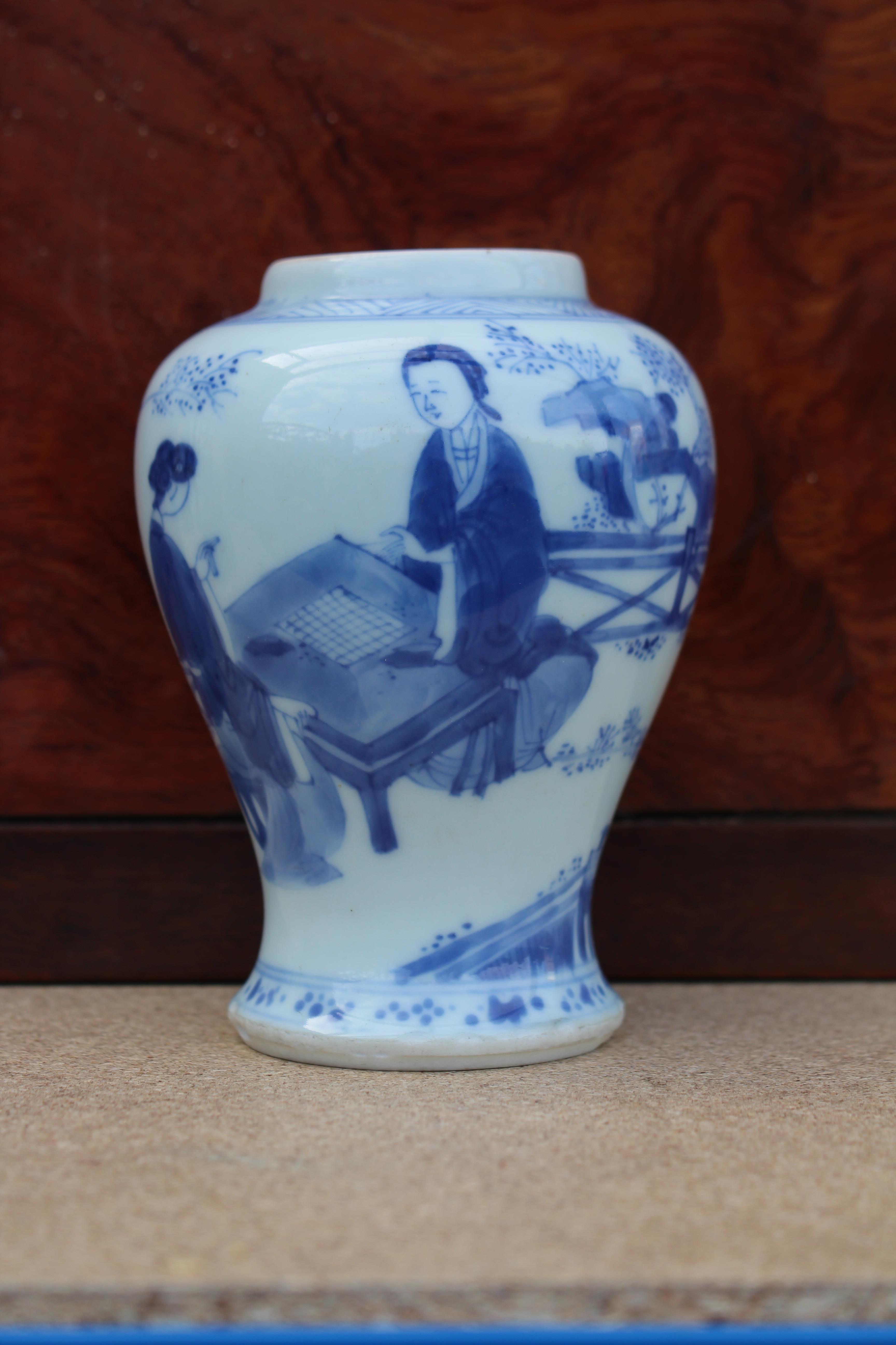 A Chinese Kangxi period blue & white porcelain small baluster vase painted with ladies in a formal - Image 4 of 11