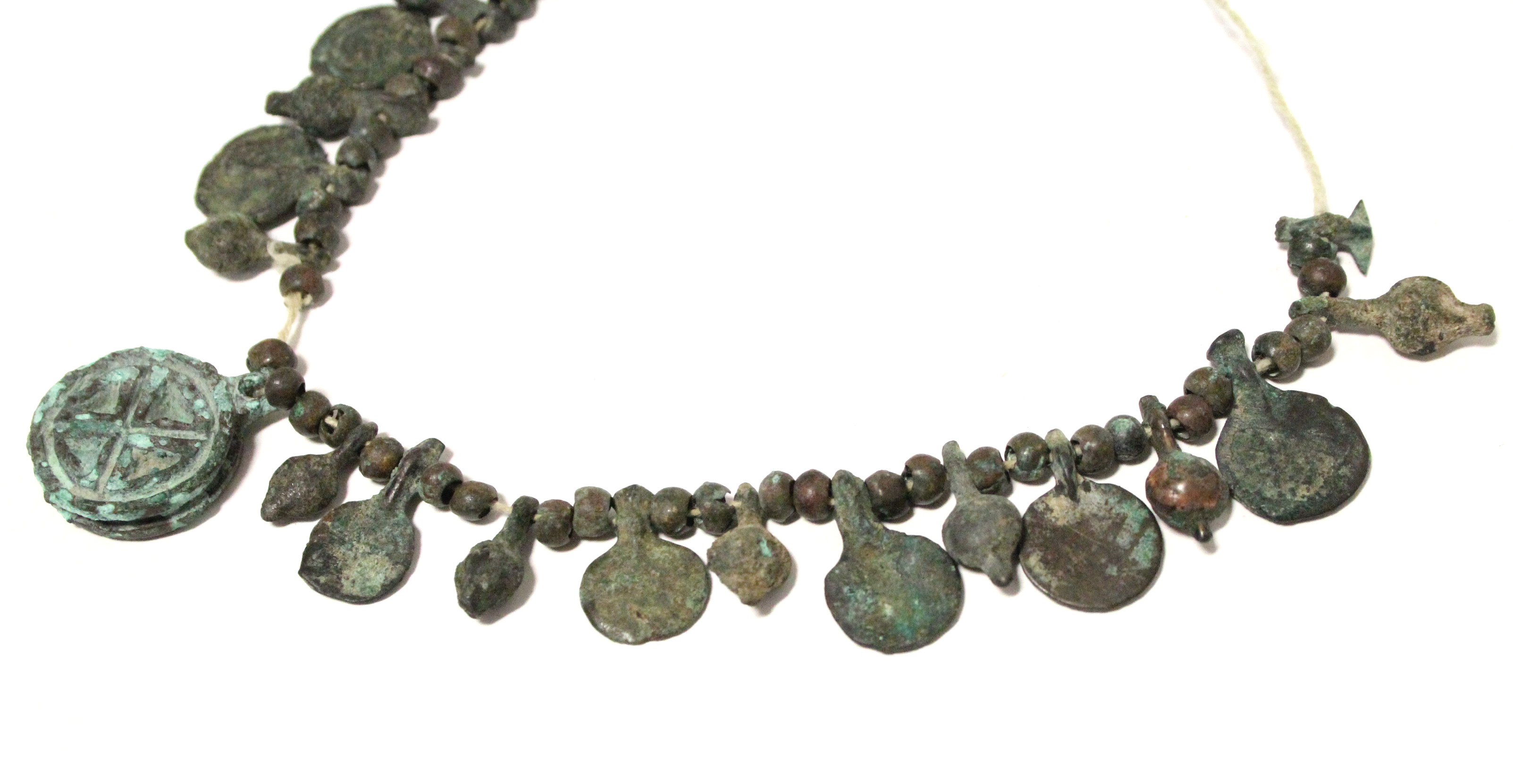 A Byzantine bronze necklace of decorated flat circular panels with small plain beads in between. - Image 3 of 3