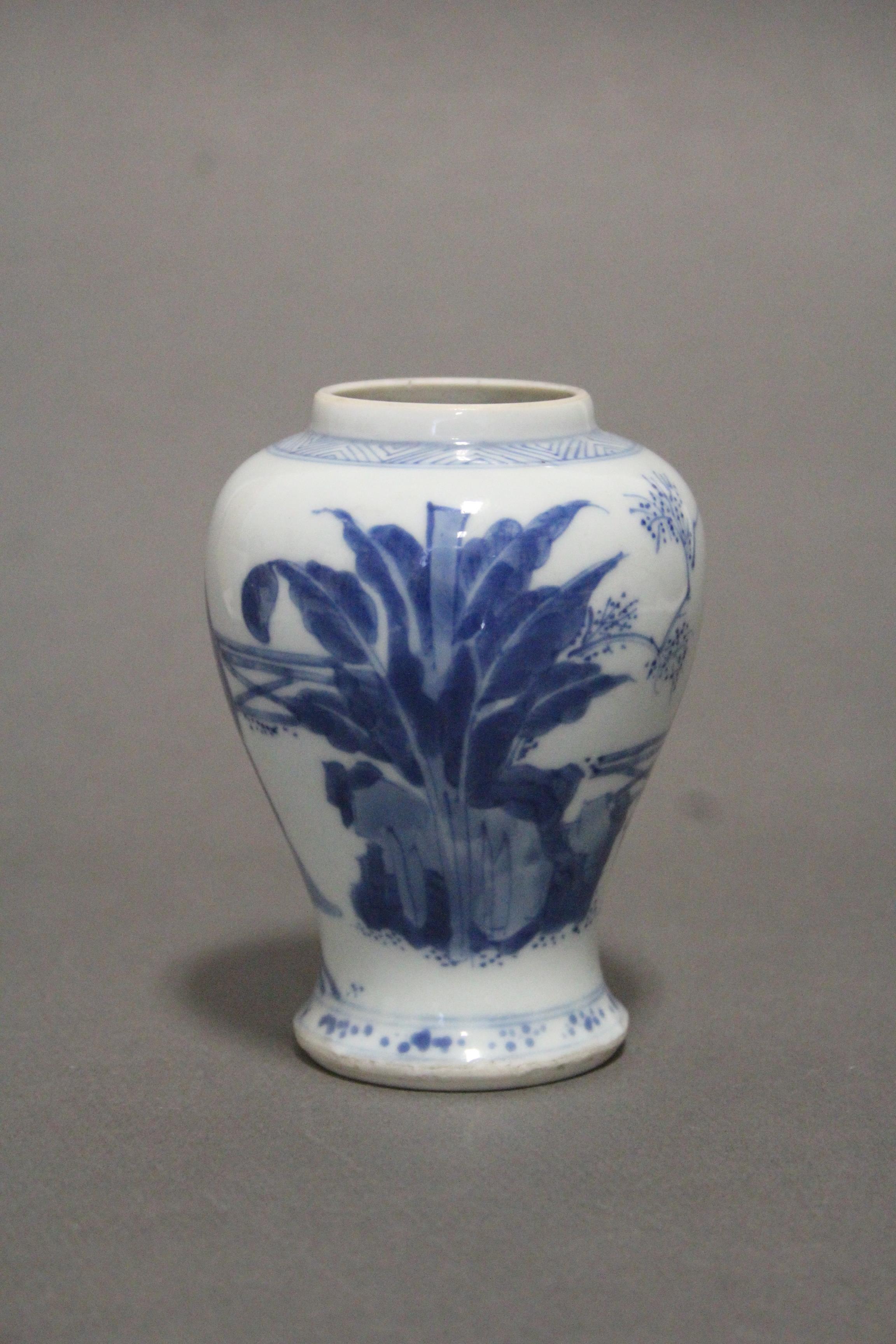 A Chinese Kangxi period blue & white porcelain small baluster vase painted with ladies in a formal - Image 9 of 11