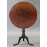 An 18th century mahogany tripod table, with circular top on vase-turned centre column & cabriole