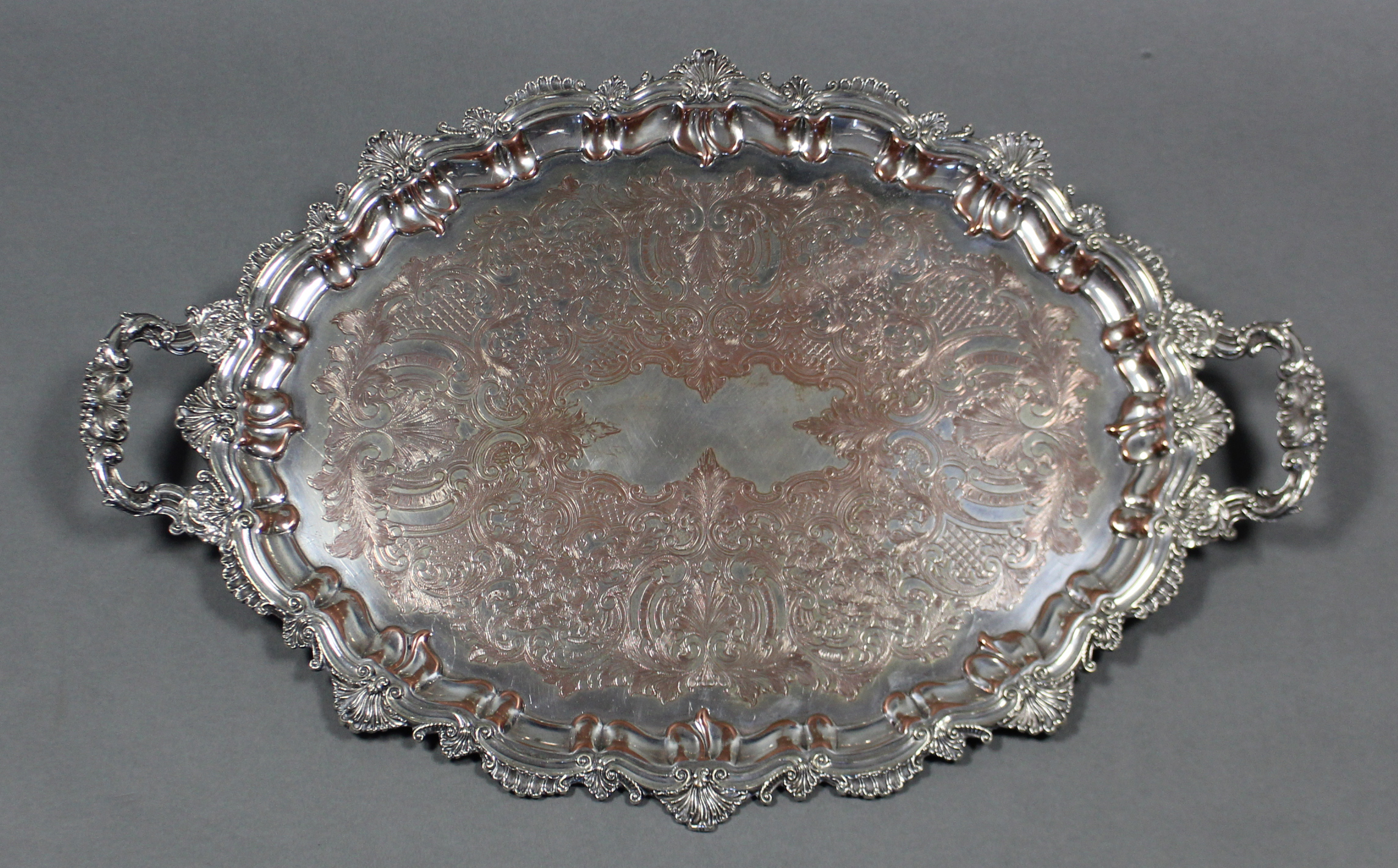 An oval two-handled tray with cast leaf-scroll rim to the raised border & chased scrollwork to the - Image 2 of 2