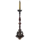 A walnut torchere, with vase-turned centre column & on triform base, 63¾” high.