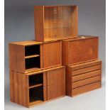 A 1960’s DANISH TEAK MODULAR INTER-CHANGEABLE WALL UNIT DESIGNED BY POUL CADOVIUS, fitted with an