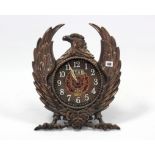 A novelty cast-metal mantel clock in “eagle” case, 15” x 17¾”.