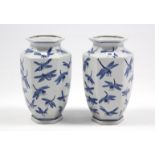A pair of Chinese porcelain vases of six-sided form, & with blue & white dragonfly decoration, 14”