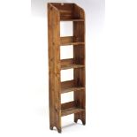 A pine five-tier standing open bookcase of narrow proportions, 18¾” wide x 66” high; & a fold-