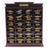 A Danbury Mint “Anglers Showcase” containing numerous fish ornaments.