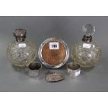 Two cut-glass globular scent bottles each with silver mount; together with a silver decanter