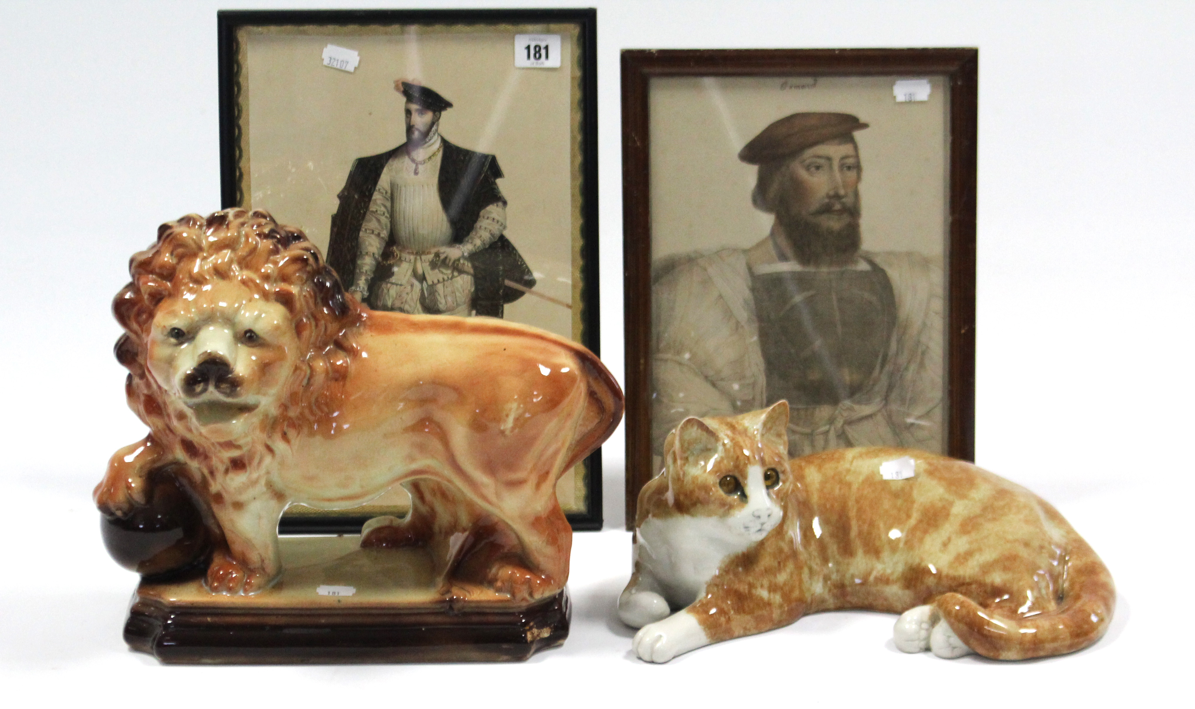 A pair of coloured prints after Holbein-male portrait studies; a large pottery cat ornament by