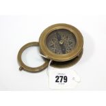 A reproduction brass cased compass/magnifying glass, 2¾” diam.