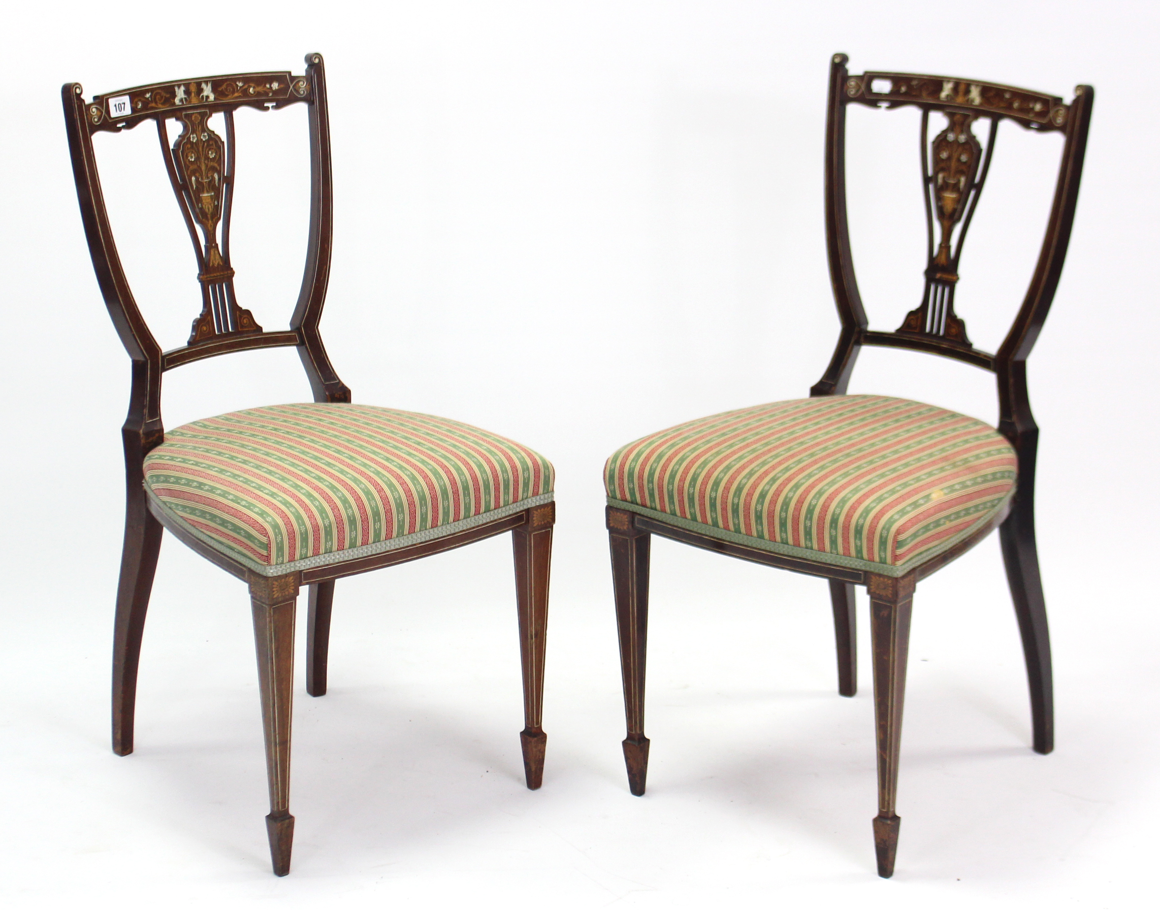 A pair of 19th century inlaid mahogany splat-back occasional chairs with padded seats, & on square