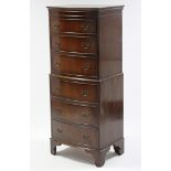 A reproduction mahogany tall bow-front chest fitted six long graduated drawers with brass swing