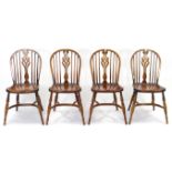 A set of four Windsor-style ash splat-back dining chairs with hard seats, & on turned tapered legs