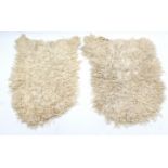 Two Alpaca-skin rugs, 45” x 35” & 45” x 32”.