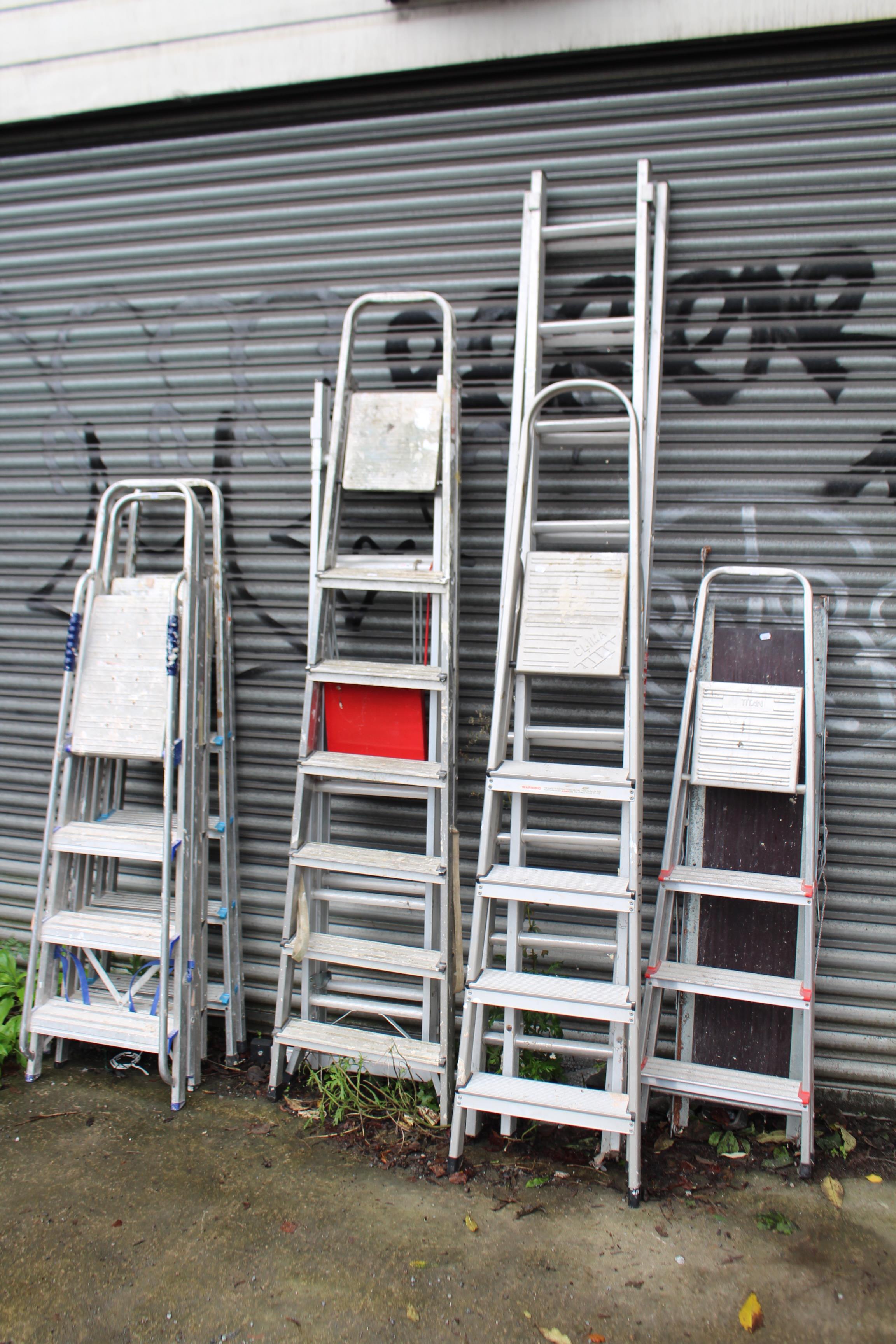 A pair of crimson painted wooden tall decorator’s trestles, 72” high; & seven various aluminium step - Image 6 of 9