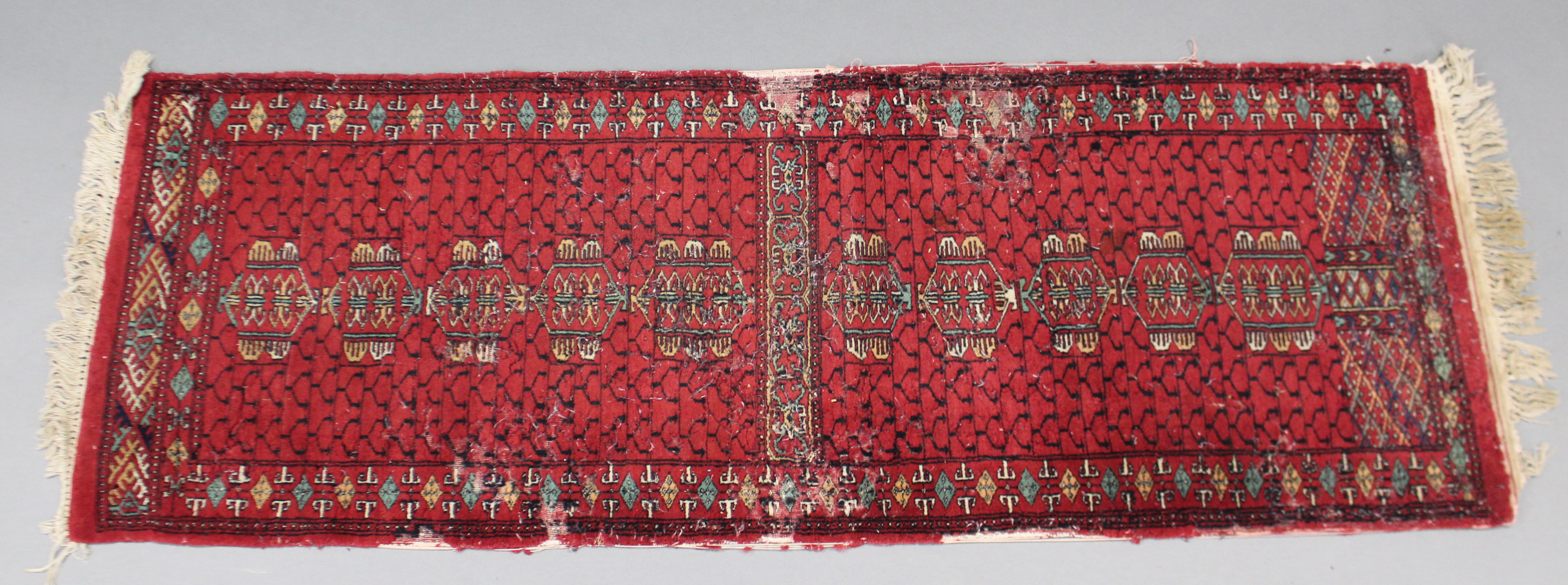 A Kelim rug of crimson ground, 74" x 40" (worn); & a Bokhara small runner, 72" x 25½" (worn). - Image 2 of 2