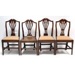 Four Hepplewhite-style mahogany dining chairs (one with hard seat), each on square tapered legs with