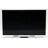 A Panasonic 48” LED television with remote control.