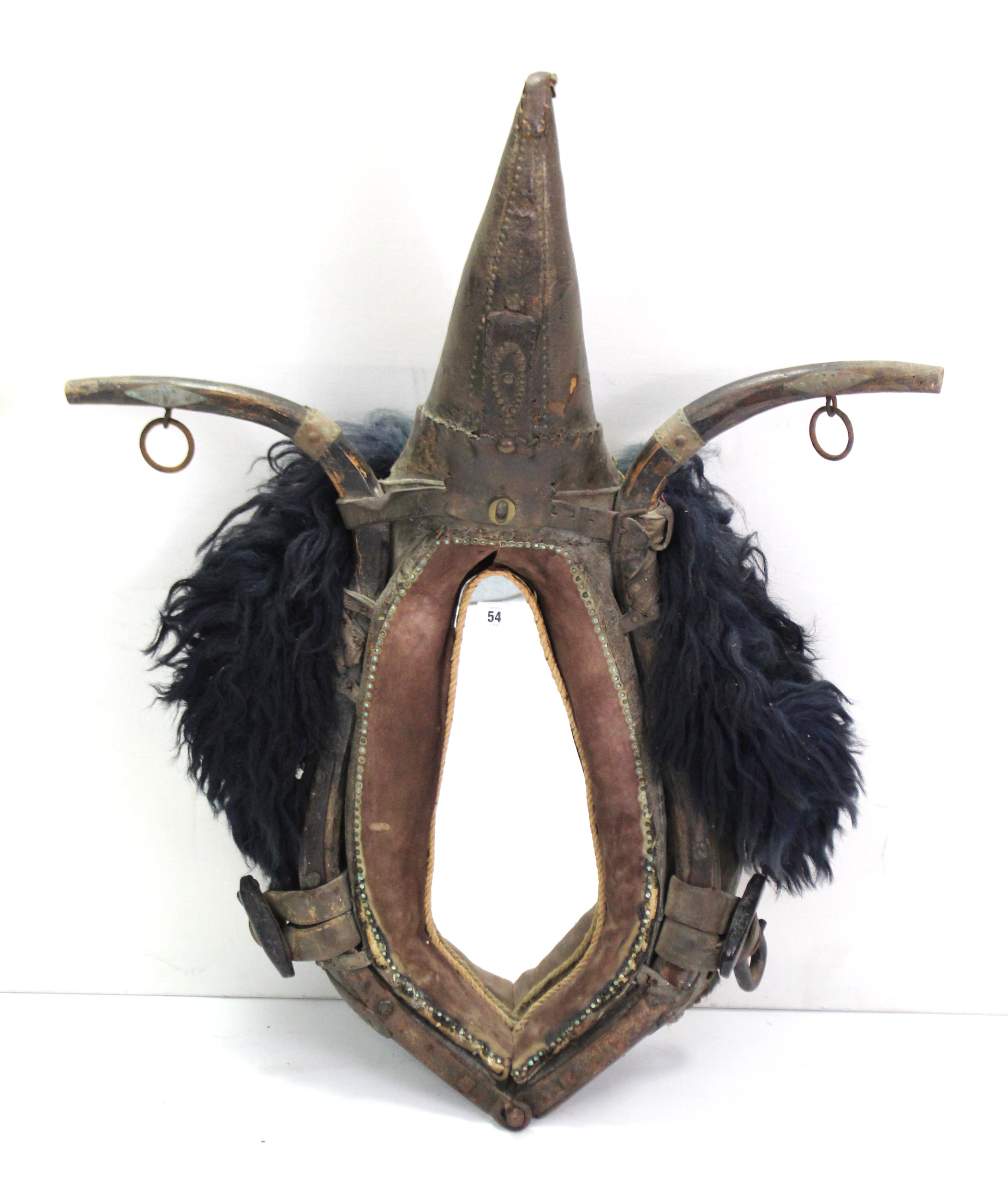 A novelty wall mirror made from an old Spanish donkey harness, 37” x 30½”; together with seven