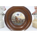 An Edwardian inlaid-mahogany frame wall mirror, 29 x 35¼”; two Prattware type pot lids, both framed;