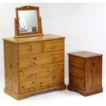 A pine chest fitted two short & three long graduated drawers with brass swan-neck handles, & on