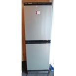 A Hotpoint upright frost-free fridge-freezer in silvered finish case, 70½” high.