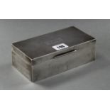 A silver engine-turned rectangular two-division cigarette box with hinged lift-lid, Birmingham 1936,