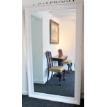 A large rectangular wall mirror in white finish frame, & inset bevelled plate, 81” x 47”.