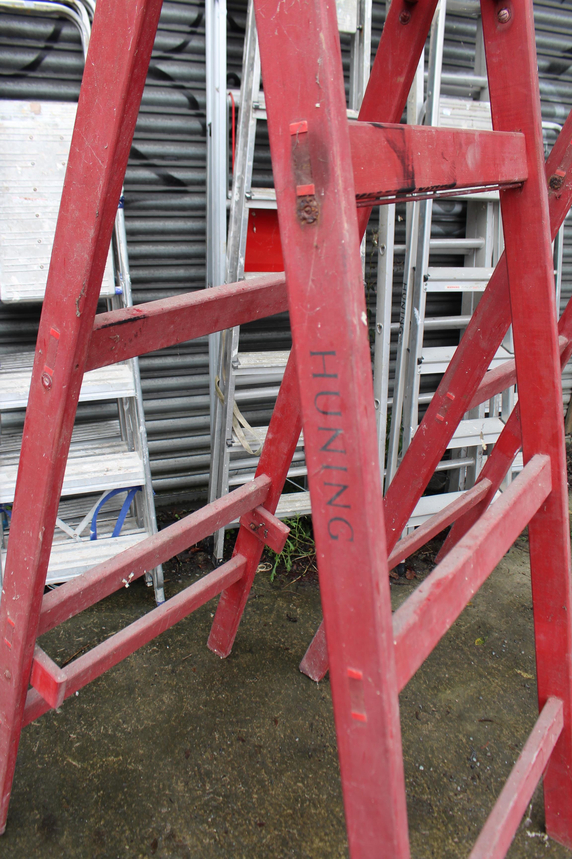 A pair of crimson painted wooden tall decorator’s trestles, 72” high; & seven various aluminium step - Image 3 of 9