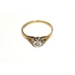 A 9ct gold dress ring inset with small diamond.