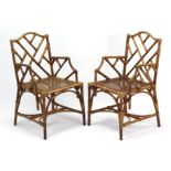 A pair of cane conservatory armchairs each inset woven-cane seat (slight faults).