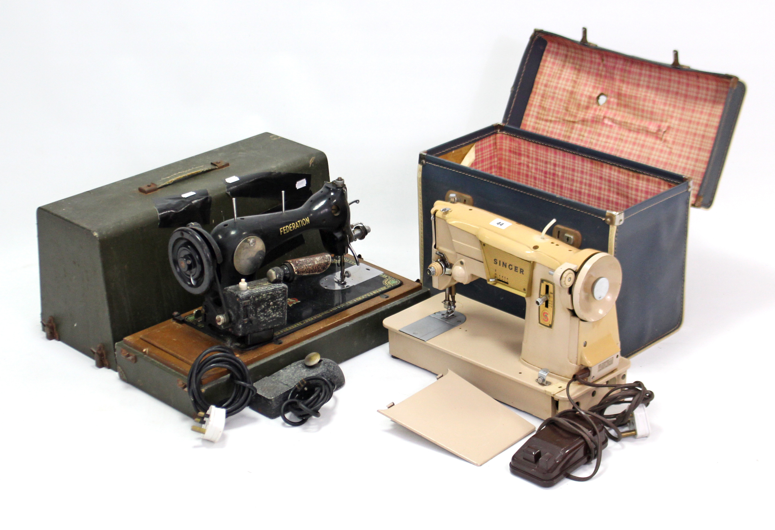 A Singer electric sewing machine; & a Federation ditto, each with case.