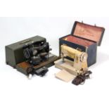 A Singer electric sewing machine; & a Federation ditto, each with case.