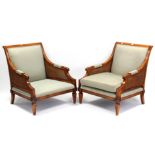 A pair of reproduction mahogany-frame bergere armchairs upholstered pale green material, inset