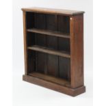 An oak standing open bookcase with three adjustable shelves, & on plinth base, 39” wide x 42¾”